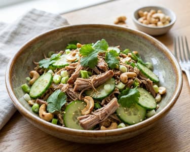 Salad with tender Pulled Pork and Cashews
