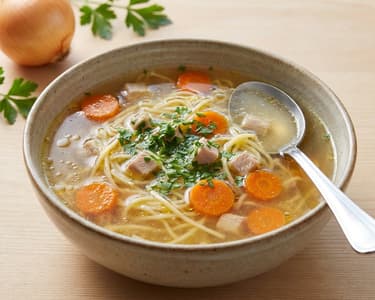Hearty Rooster Broth with Root Vegetables and Noodles