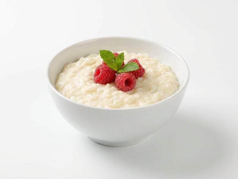 Cremiger Milchreis mit Himbeeren